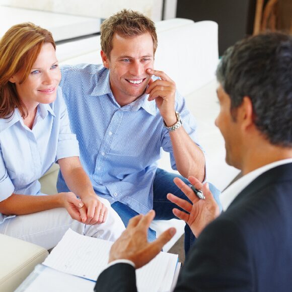 Couple discussing with a professional advisor.
